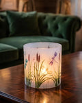 WaxHurricane lantern on a wooden table in a lounge
