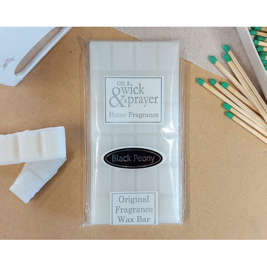 On a Wick Wax bar with matches . Black Peony Fragrance