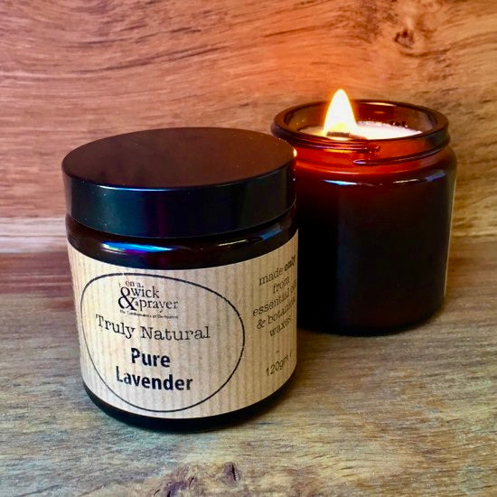 'Truly Natural Pure Lavender' candle on a wooden surface