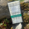 Peak Forest fragrance wax melt bar on a stone background