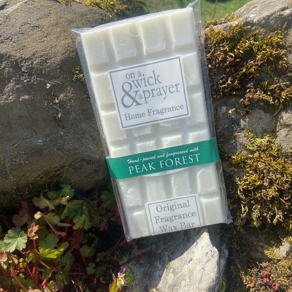 Peak Forest fragrance wax melt bar on a stone background